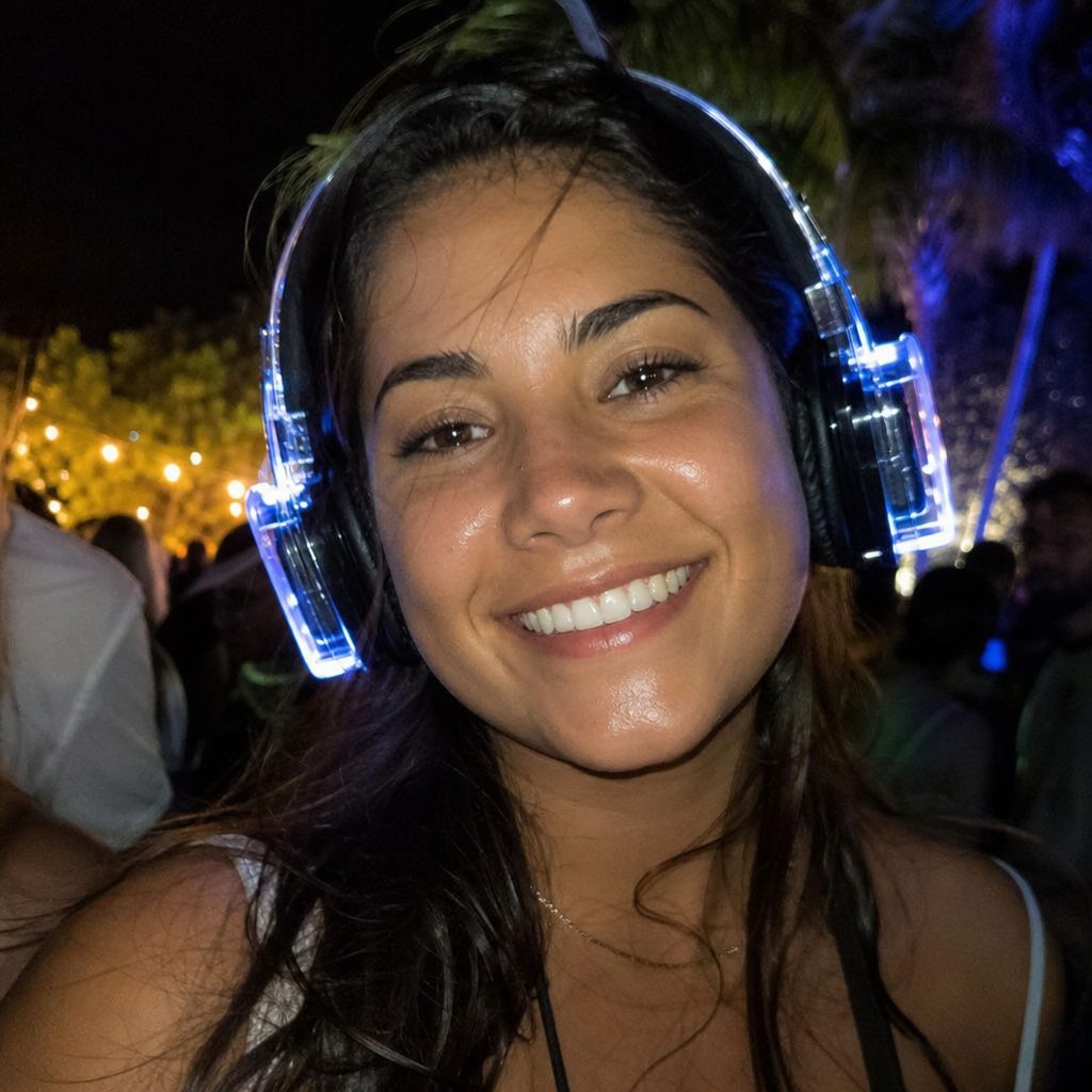 Guest smiling in glowing blue wireless headphones